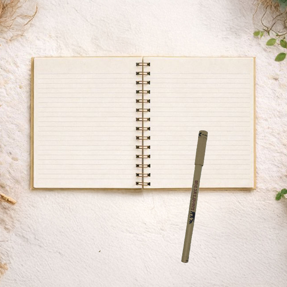 Open spiral notebook with lined pages and a plantable pen