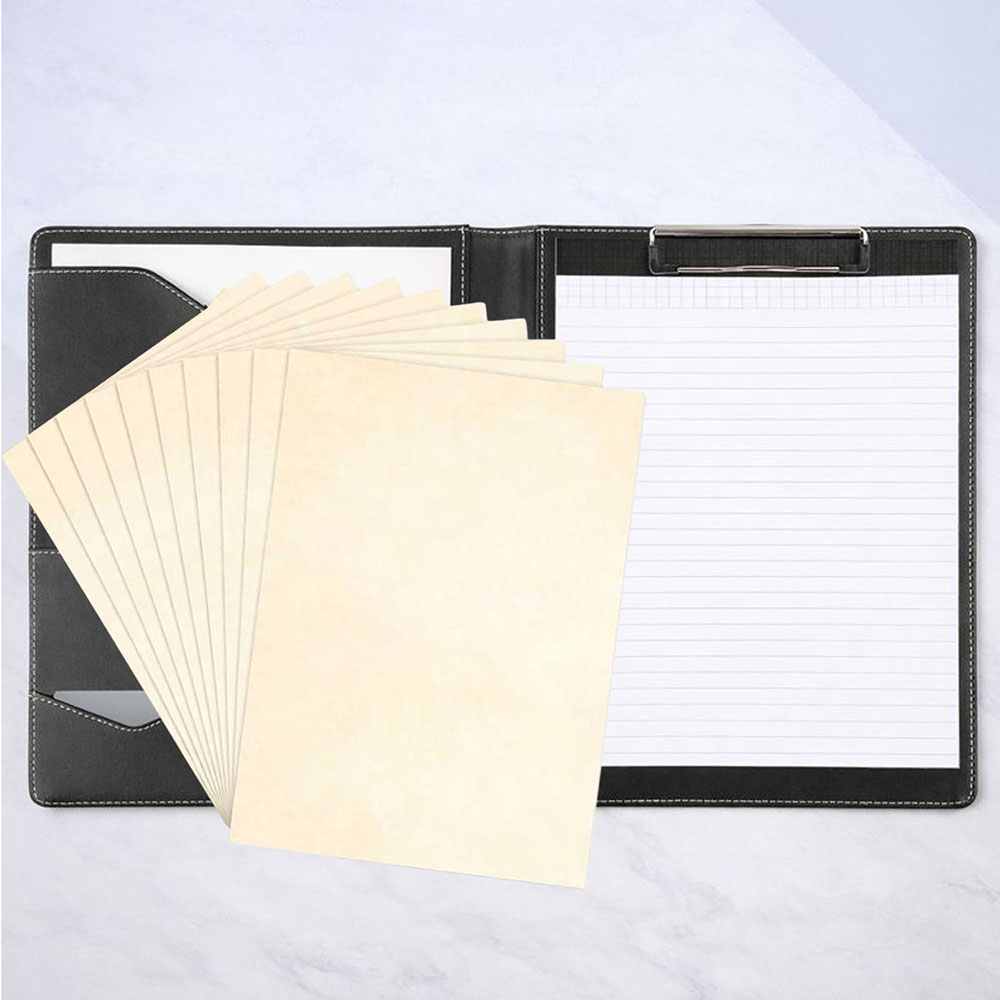 Writing pad attached to a metal clipboard inside a folder